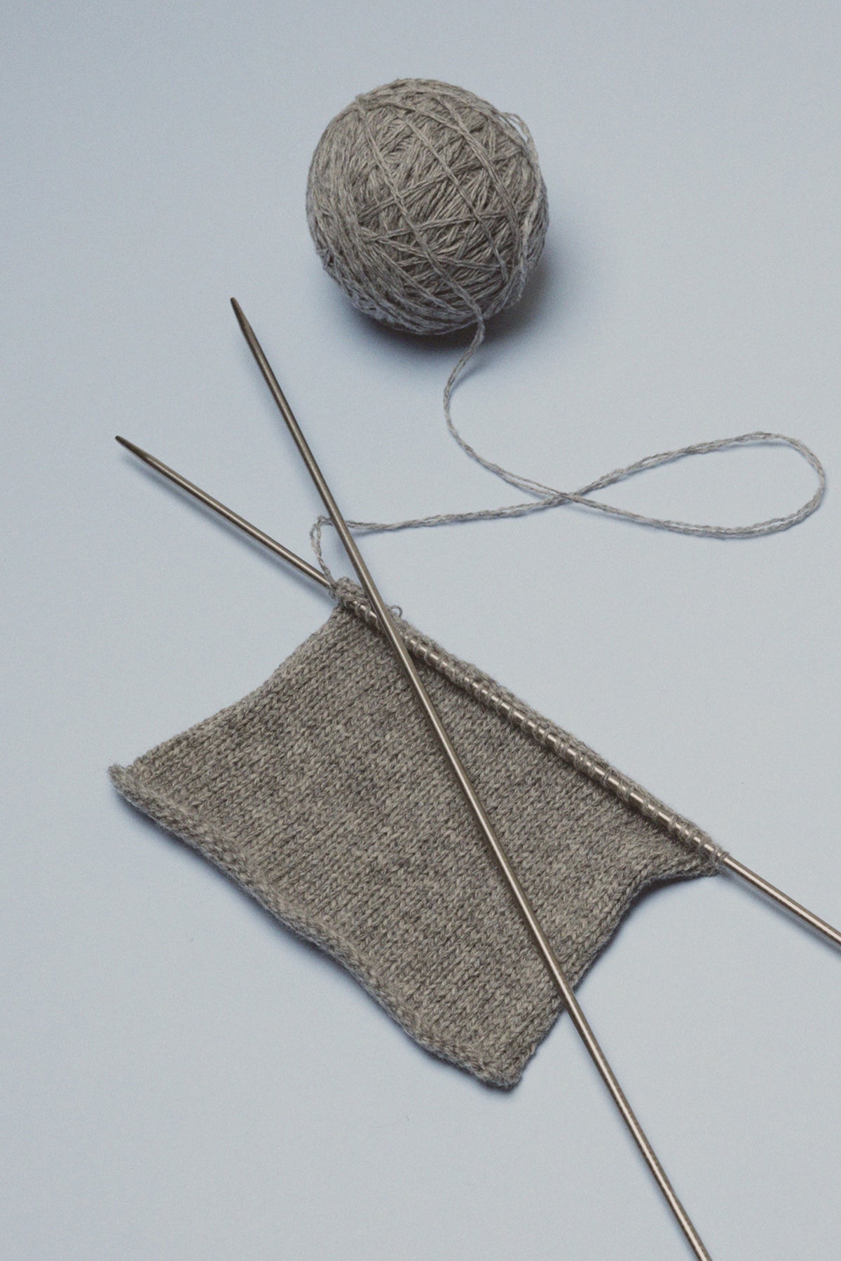 Ball of yarn and knitting needles