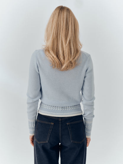 Betsy Jumper in Powder Blue cashmere, worn with dark denim, back.