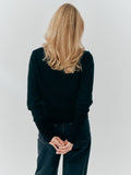 Betsy Jumper in Black cashmere, back view worn with dark denim