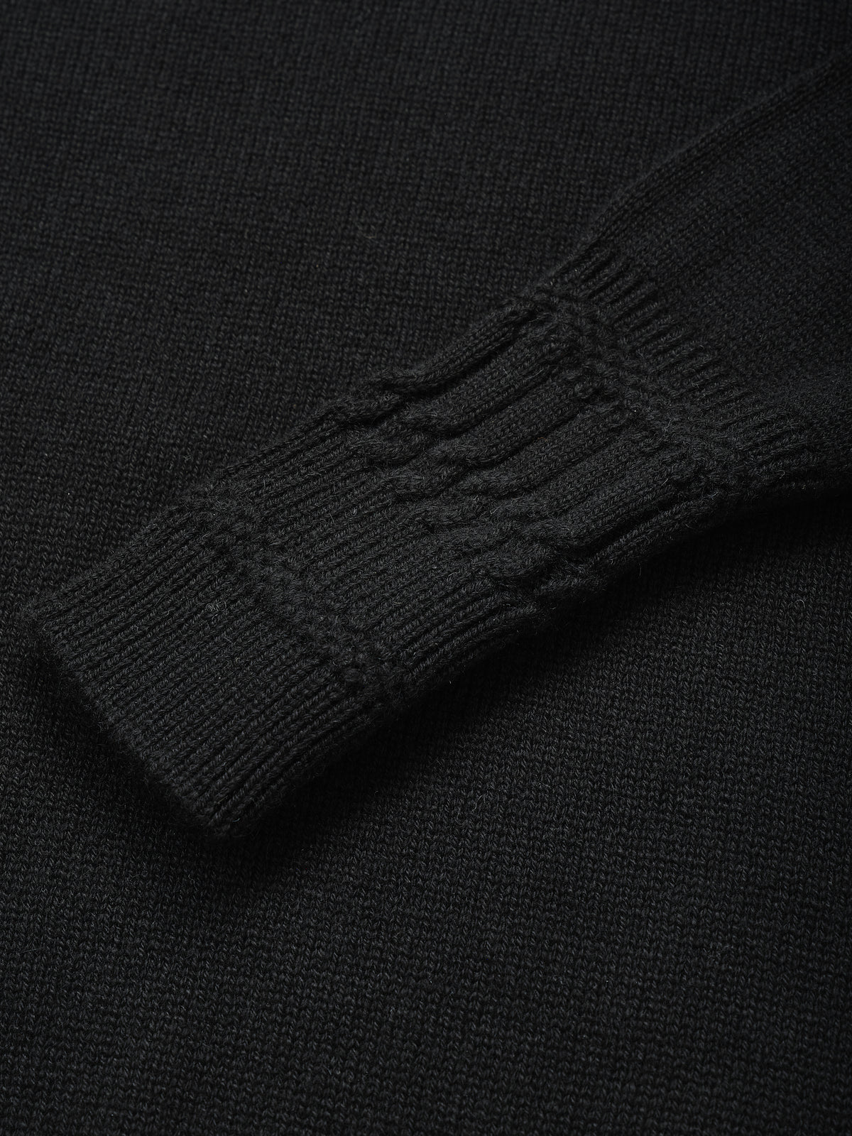 Close-up of the knit and trim detail on the Betsy Jumper in Black