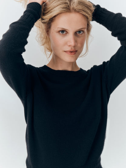 Betsy Jumper in Black cashmere, showing the wide crew neckline