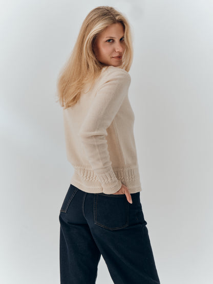 Emma Cardigan in Champagne cashmere, back view worn with dark jeans