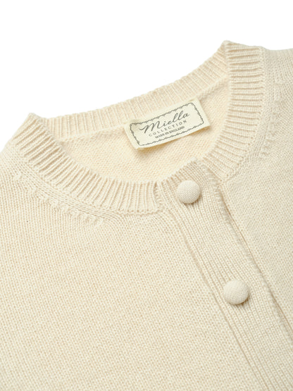 Miella Collection label inside the Emma Cardigan in Champagne