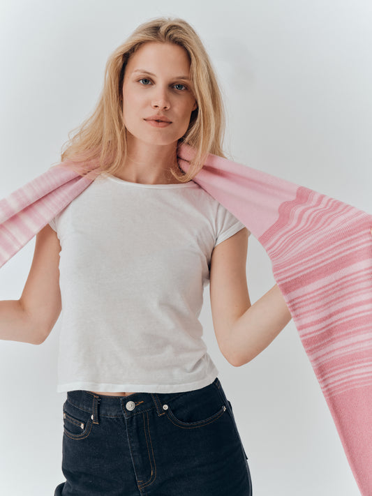Gradient Scarf in Blossom draped over the shoulders, showing the pink gradation